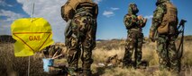 Marines go through a simulated decontamination center after a scenario simulating a chemical attack March 13 during Dragon Fire Exercise 15-2 at Pohakuloa Training Area. The Marines are with Headquarters Battery, 12th Marine Regiment, 3rd Marine Division, III Marine Expeditionary Force. (U.S. Marine Corps photo by Lance Cpl. William Hester/ Released) Cropped version of 150314-M-XX123-417