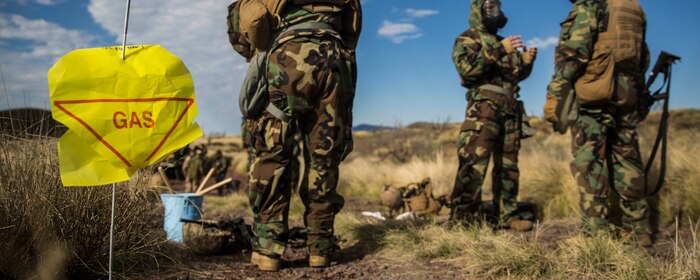 Marines go through a simulated decontamination center after a scenario simulating a chemical attack March 13 during Dragon Fire Exercise 15-2 at Pohakuloa Training Area. The Marines are with Headquarters Battery, 12th Marine Regiment, 3rd Marine Division, III Marine Expeditionary Force. (U.S. Marine Corps photo by Lance Cpl. William Hester/ Released) Cropped version of 150314-M-XX123-417