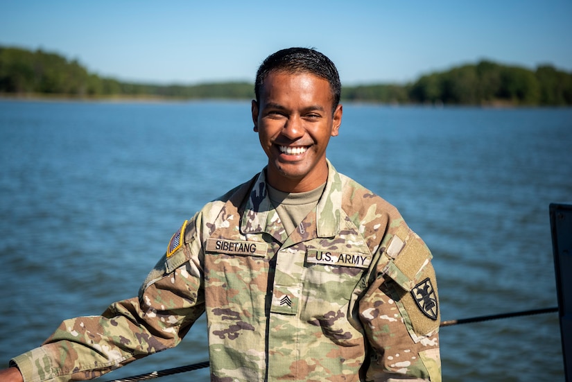 Sgt. Judah Sibetang, 331st Transportation Company, 11th Transportation Battalion, 7th Transportation Brigade (Expeditionary), coxswain, stands along the starboard-side railing of a Class B warping tug vessel at Joint Base Langley-Eustis, Virginia, September 21, 2022.