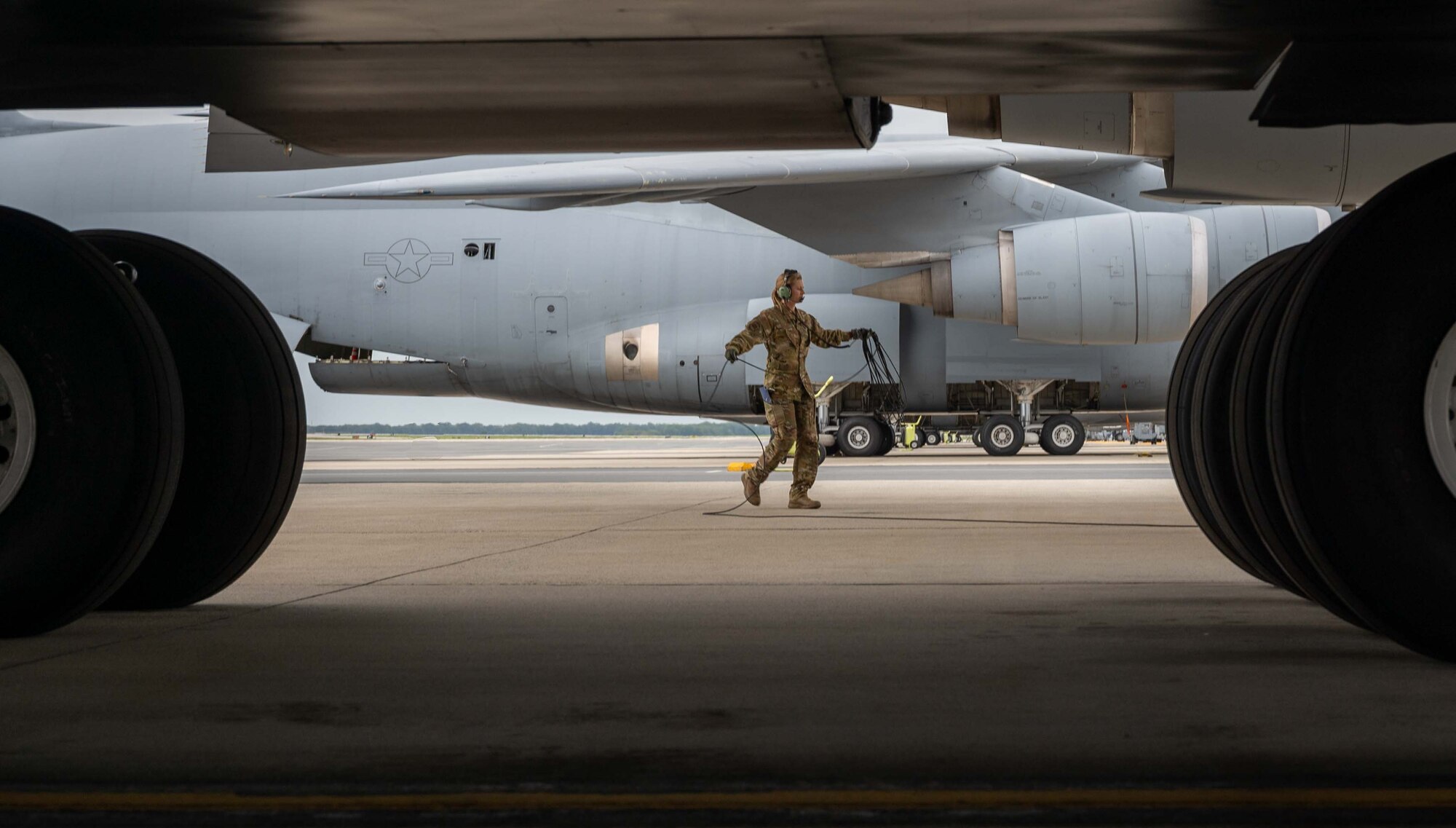 Prior to taking off for an outreach event, Staff Sgt. Stephanie Garber, 709th Airlift Squadron flight engineer, completes a C-5M Super Galaxy preflight check at Dover Air Force Base, Delaware, Sept. 30, 2022. During the outreach event, the Team Dover total force aircrew gave tours to more than 175 cadets from the United States Air Force Academy, USAFA Preparatory School and their family members. (U.S. Air Force photo by Senior Airman Faith Barron)