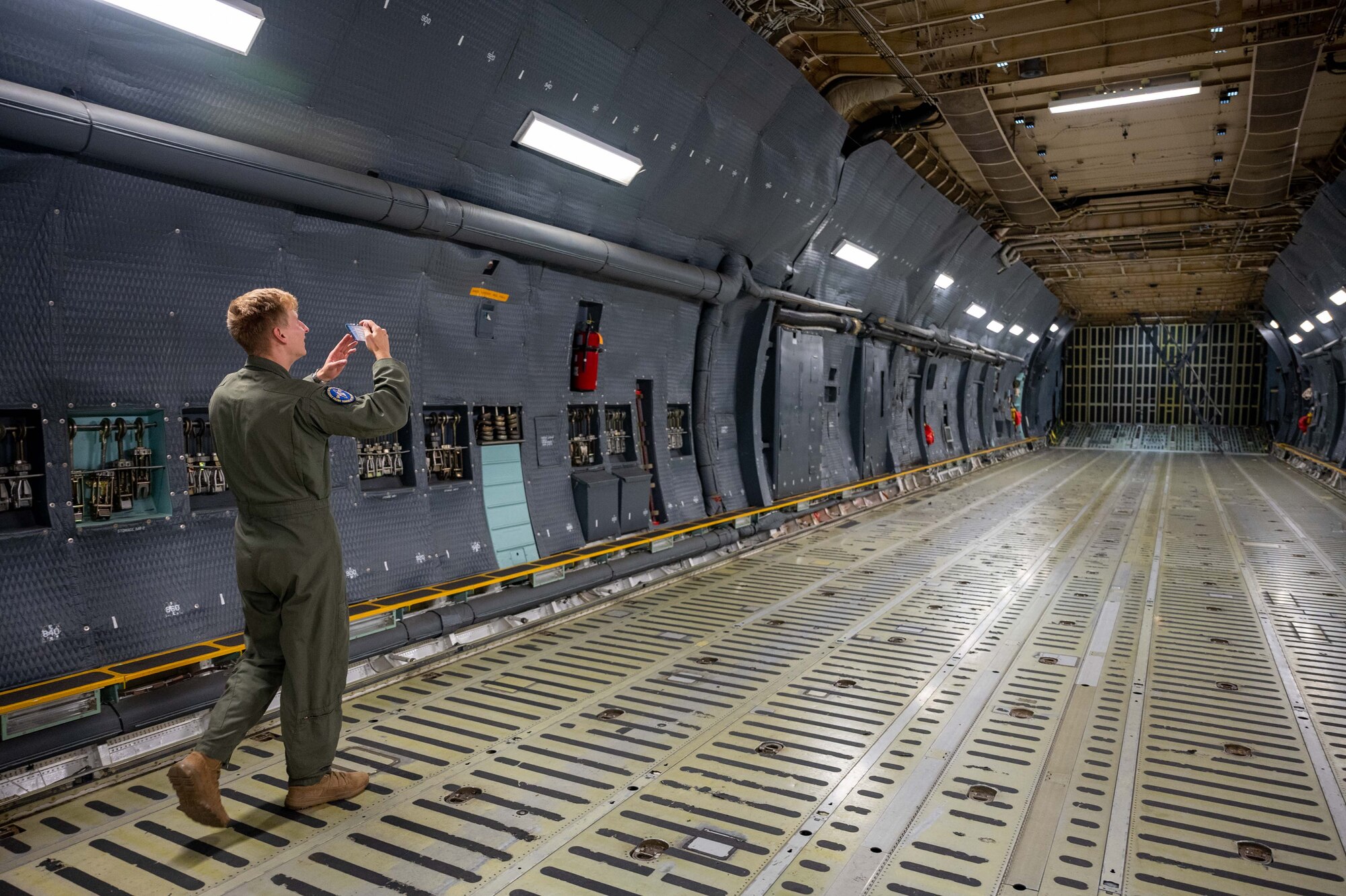 A cadet from the United States Air Force Academy tours the inside of a Dover Air Force Base C-5M Super Galaxy at Peterson Space Force Base, Colorado, Sept. 30, 2022. During the outreach event, the Team Dover total force aircrew gave tours to more than 175 cadets from USAFA, USAFA Preparatory School and their family members. (U.S. Air Force photo by Senior Airman Faith Barron)