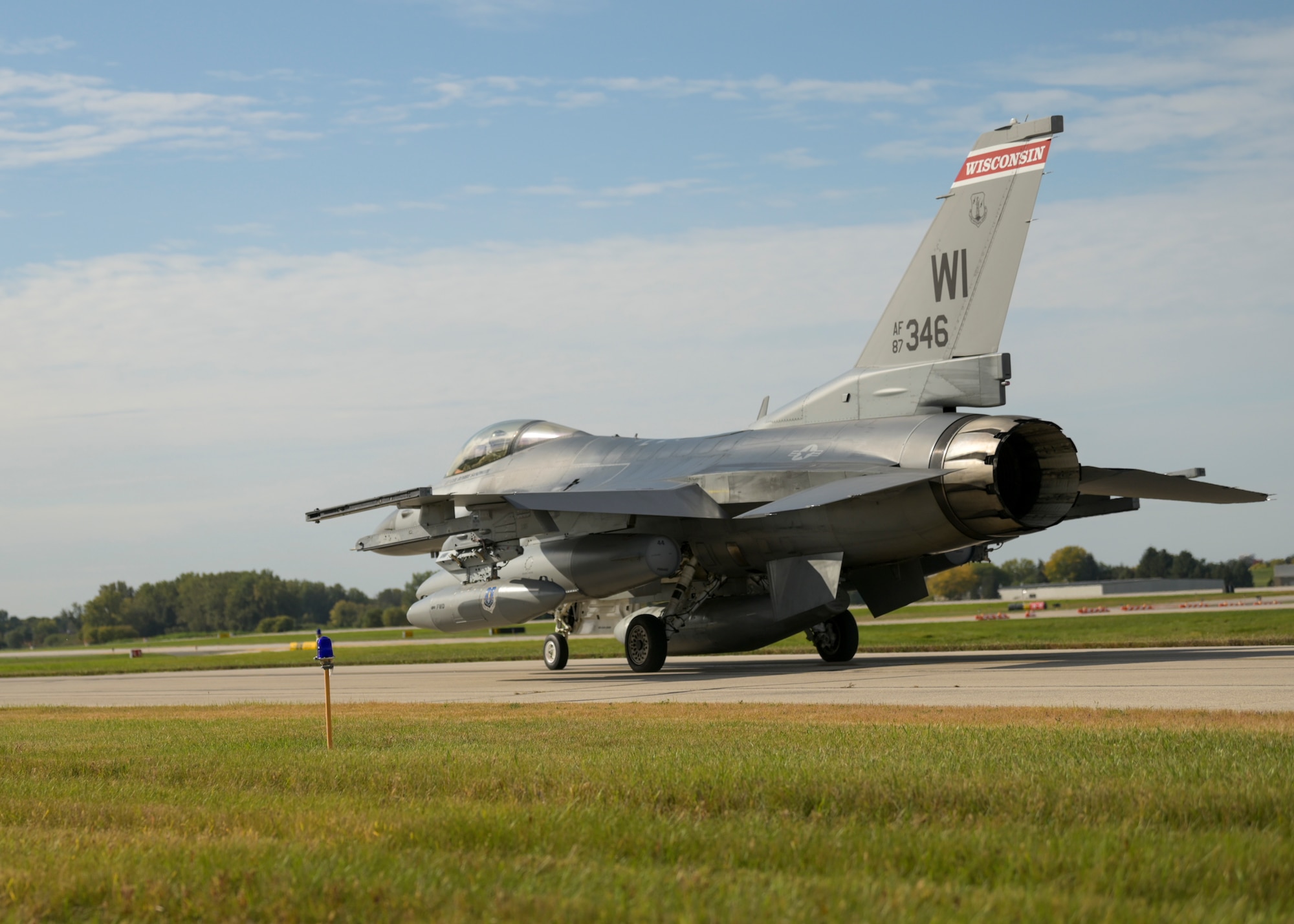 F-16 Fighting Falcon aircraft assigned to the Wisconsin Air National Guard's 115th Fighter Wing, overfly Truax Field, Madison, Wisconsin during a ceremony commemorating the units final departure with the aircraft Oct. 5, 2022. The F-16 first arrived at Truax Field in 1992 as the eighth primary airframe since the units inception in 1948 and is scheduled to be replaced by the F-35 Lightning II aircraft in the Spring of 2023. (U.S. Air National Guard photo by Staff Sgt. Cameron Lewis)