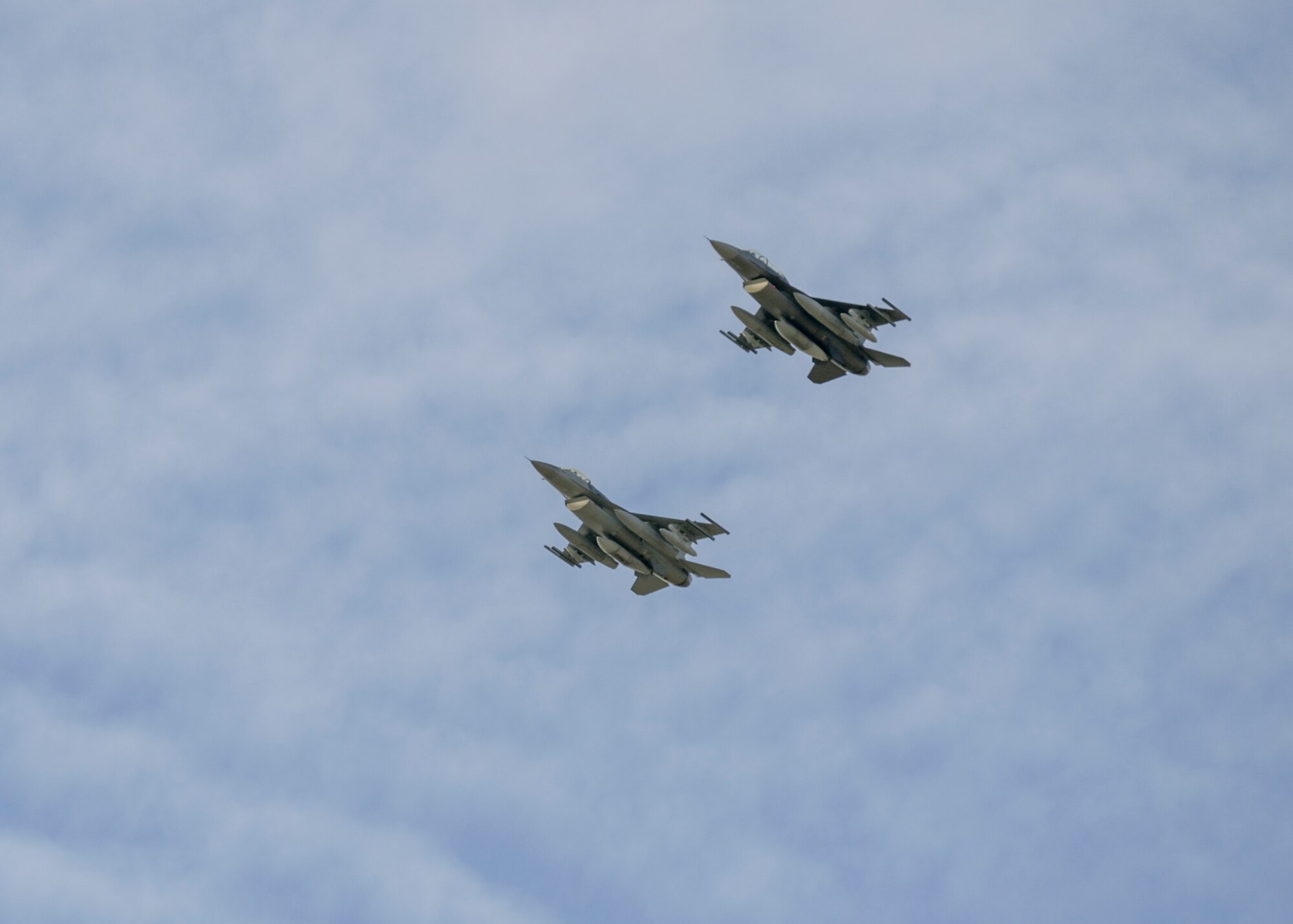 F-16 Fighting Falcon aircraft assigned to the Wisconsin Air National Guard's 115th Fighter Wing, overfly Truax Field, Madison, Wisconsin during a ceremony commemorating the units final departure with the aircraft Oct. 5, 2022. The F-16 first arrived at Truax Field in 1992 as the eighth primary airframe since the units inception in 1948 and is scheduled to be replaced by the F-35 Lightning II aircraft in the Spring of 2023. (U.S. Air National Guard photo by Staff Sgt. Cameron Lewis)