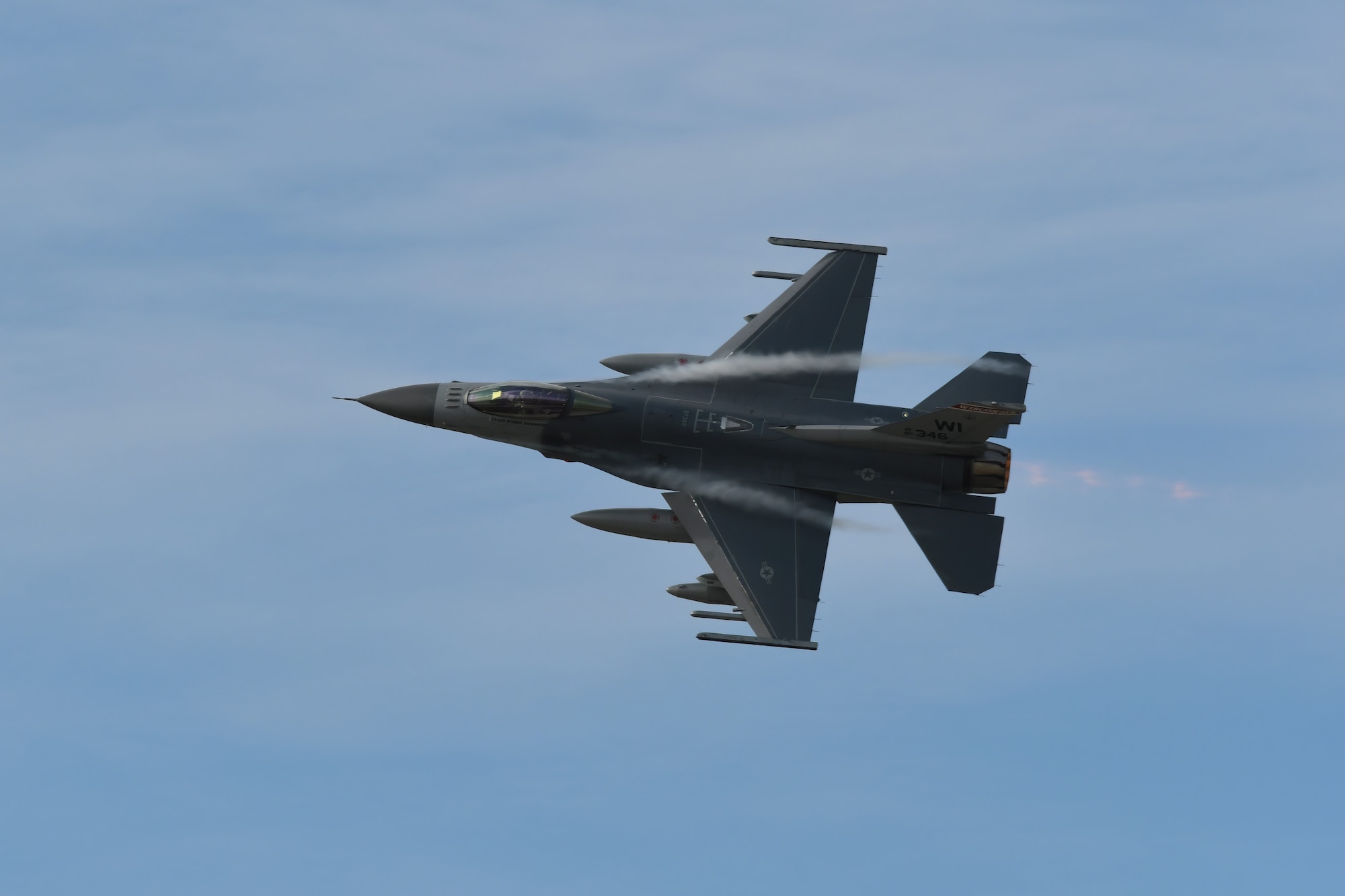 An F-16 Fighting Falcon aircraft assigned to the Wisconsin Air National Guard's 115th Fighter Wing, overfly Truax Field, Madison, Wisconsin during a ceremony commemorating the units final departure with the aircraft Oct. 5, 2022. The F-16 first arrived at Truax Field in 1992 as the eighth primary airframe since the units inception in 1948 and is scheduled to be replaced by the F-35 Lightning II aircraft in the Spring of 2023. (U.S. Air National Guard photo by Senior Master Sgt. Paul Gorman)