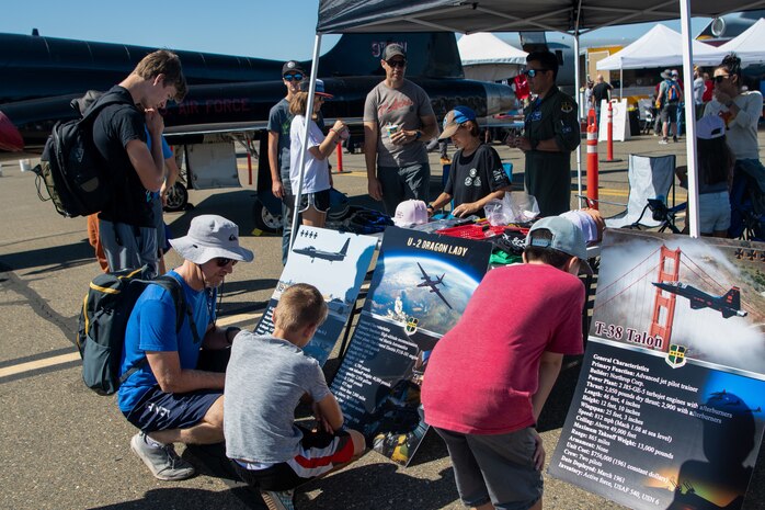 A group of people look at a static display during the California Capital Airshow at Mather Airport, Calif., on Oct. 2, 2022.