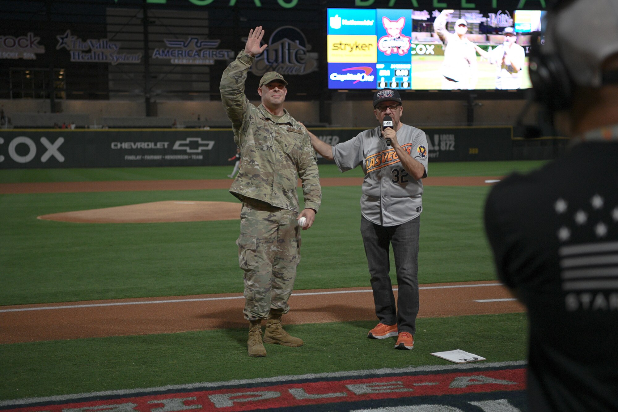 Staff Sgt. David Crane, an active component Enlisted Accessions recruiter with the 368th Recruiting Squadron in Las Vegas waves to fans.