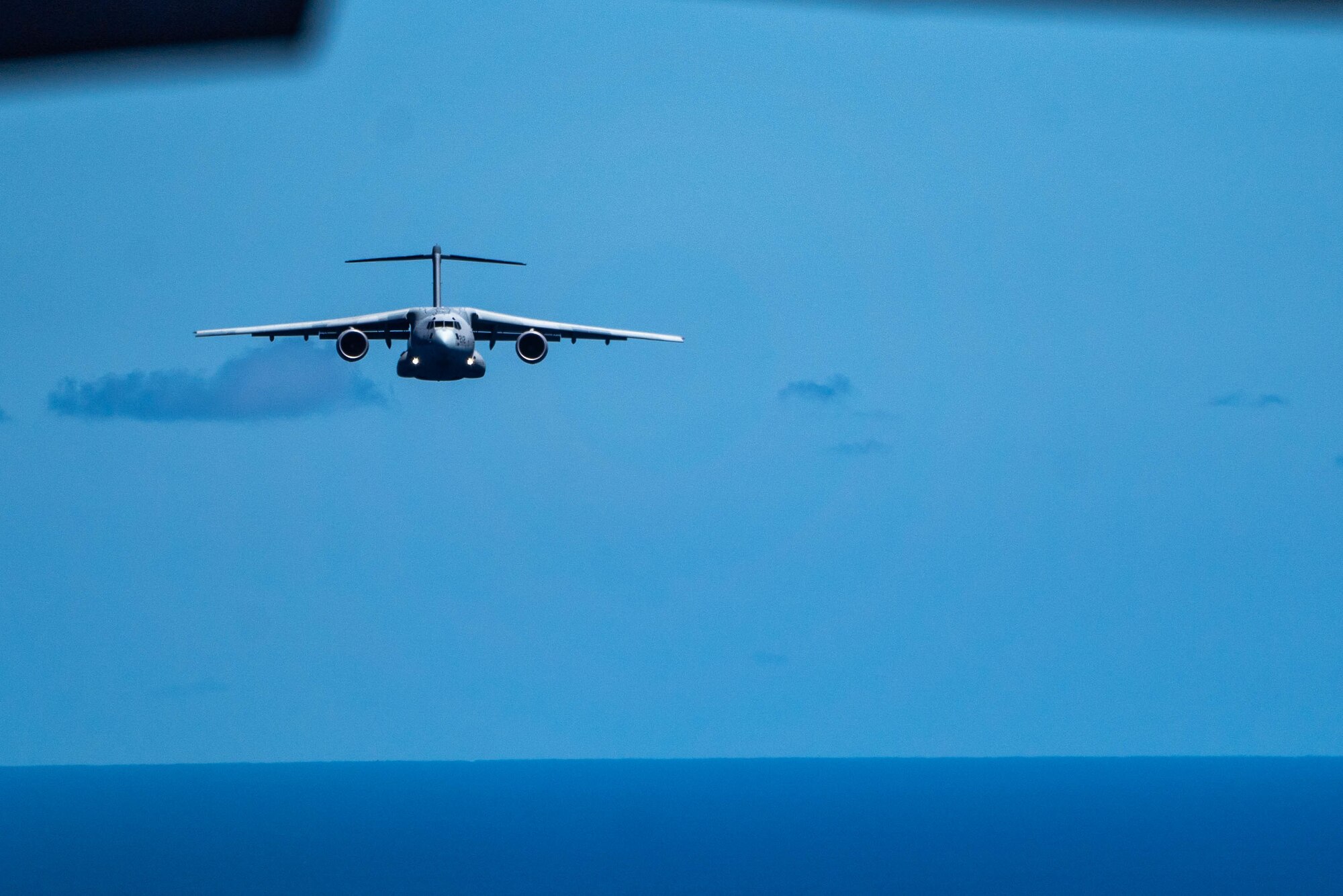 A Kawasaki C-2 from the Japan Air Self-Defense Force (Koku-Jieitai), 403rd Tactical Airlift Squadron flies in a formation during a bilateral training exercise with the 535th Airlift Squadron around the Hawaiian Islands, Sept. 27, 2022.  Bilateral exercises between the USAF and JASDF advance the operational concepts and capabilities of both countries and increase interoperability. (U.S. Air Force photo by Senior Airman Makensie Cooper)