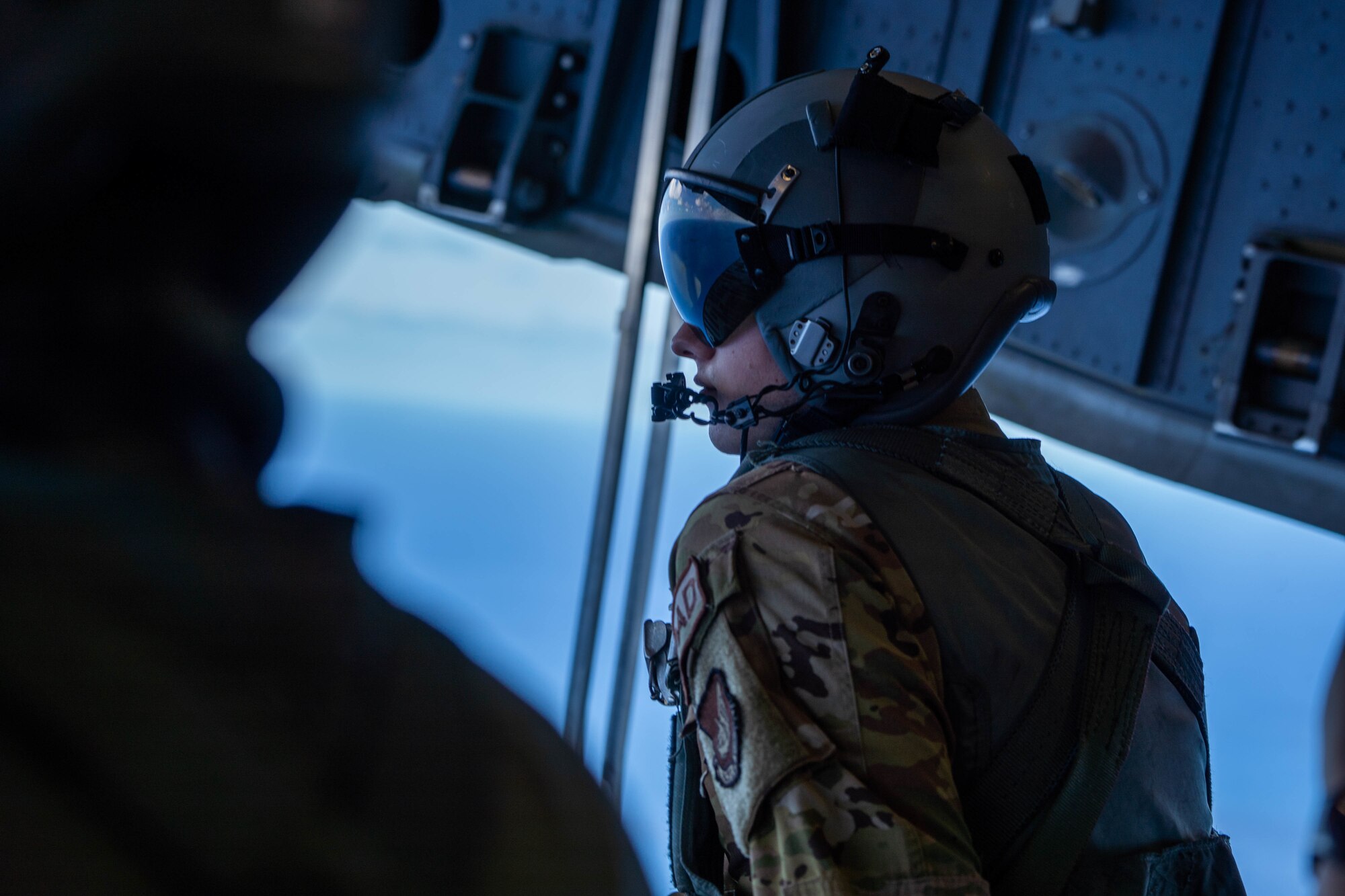 U.S Air Force Senior Airman Andrew Girard, 535th Airlift Squadron loadmaster, sits on the ramp of a C-17 Globemaster III during a bilateral training exercise with Japan Air Self-Defense Force 403rd Tactical Airlift Squadron members around the Hawaiian Islands, Sept. 27, 2022. The 3-day bilateral exercise familiarized aircrew from both forces on the capabilities of the Kawasaki C-2 and the C-17. (U.S. Air Force photo by Senior Airman Makensie Cooper)