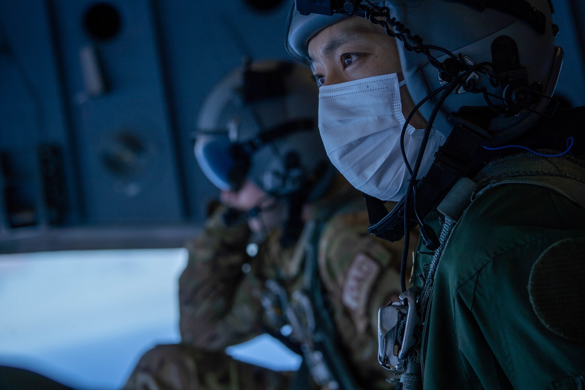 Japan Air Self-Defense Force Tech Sgt. Daichi Kubota, 403rd Tactical Airlift Squadron loadmaster, sits on the ramp of a C-17 Globemaster III during a bilateral training exercise with the 535th Airlift Squadron around the Hawaiian Islands, Sept. 27, 2022. The exercise was held to strengthen partnerships with allies and increase interoperability for future operations with the C-2 and C-17 airframes. (U.S. Air Force photo by Senior Airman Makensie Cooper)