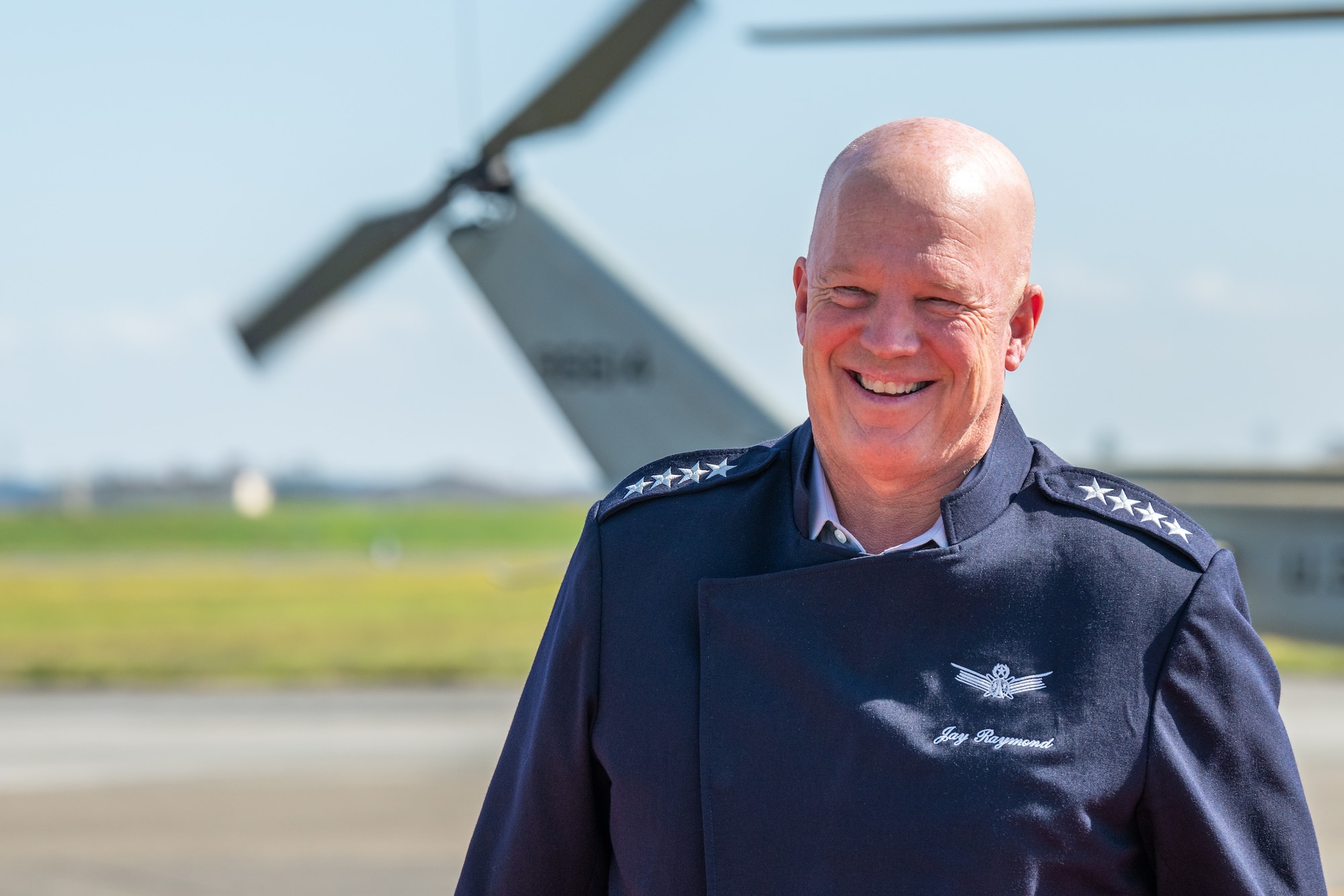 U.S. Space Force Gen. John "Jay" Raymond, Chief of Space
Operations, smiles on the flightline at Yokota Air Base, Japan, Oct. 4, 2022. During his visit, Raymond met with senior leaders, toured the base and met with Guardians assigned to the 374th Airlift Wing. (U.S. Air Force photo by Staff Sgt. Jessica Avallone)