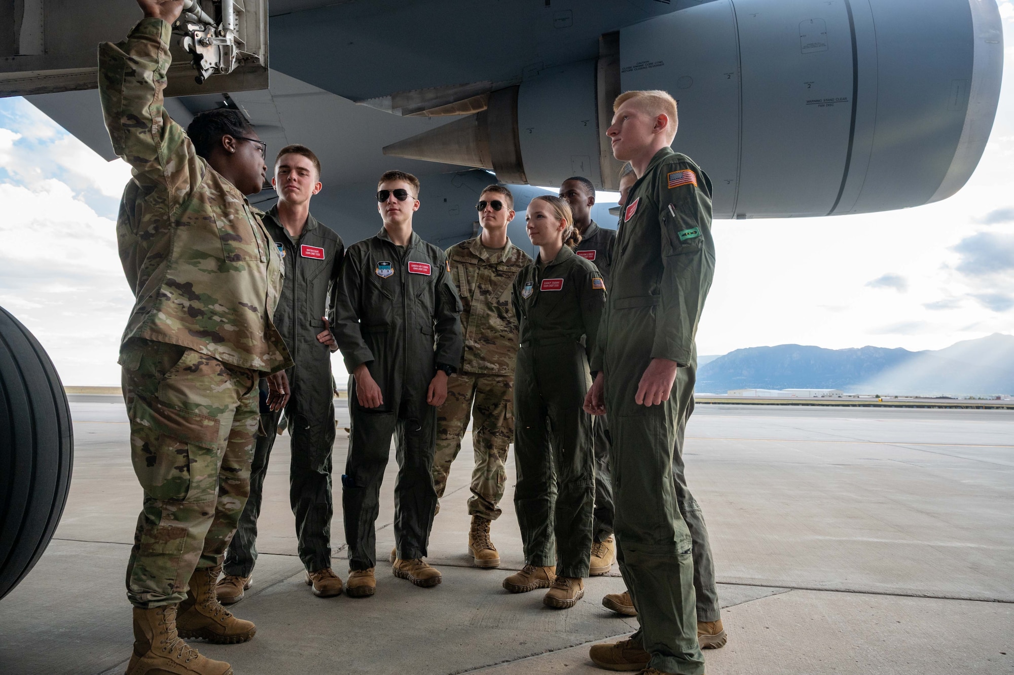 Master Sgt. Tony Relaford, left, 436th Maintenance Squadron isochronal dock section chief, briefs cadets from the United States Air Force Academy on the functions of a C-5M Super Galaxy at Peterson Space Force Base, Colorado, Sept. 30, 2022. During the event, the aircrew was able to brief over 175 cadets on science, technology, engineering and mathematics career field opportunities in the U.S. Air Force. (U.S. Air Force photo by Senior Airman Faith Barron)