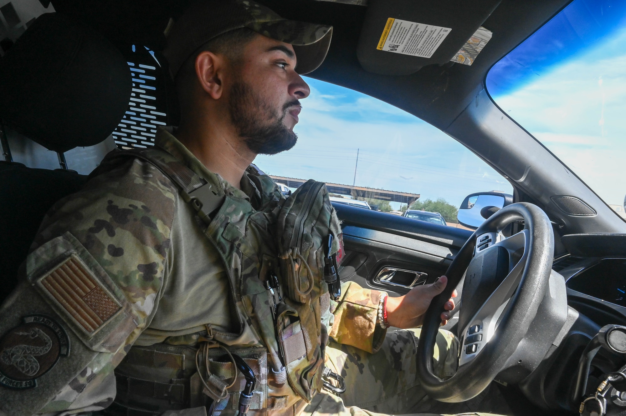 U.S. Air Force Senior Airman Bryan Bolanos, 56th Security Forces Squadron military working dog handler, patrols in his vehicle Sept. 29, 2022, at Luke Air Force Base, Arizona.