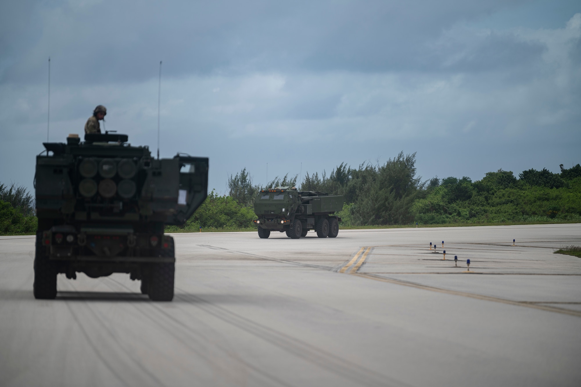 A person returns on a military vehicle