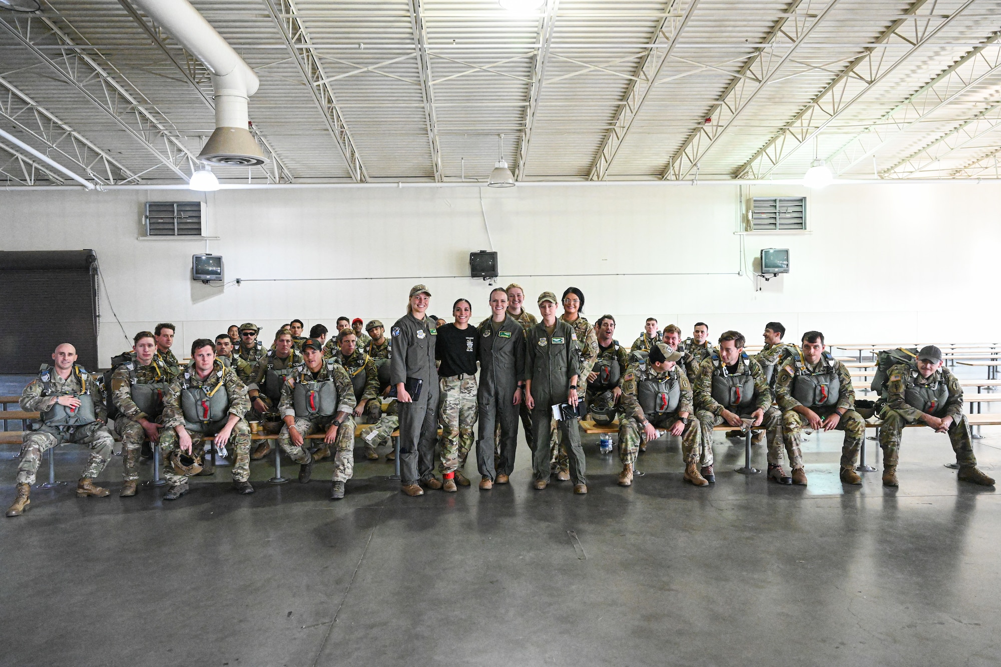 Service members pose for a photo.