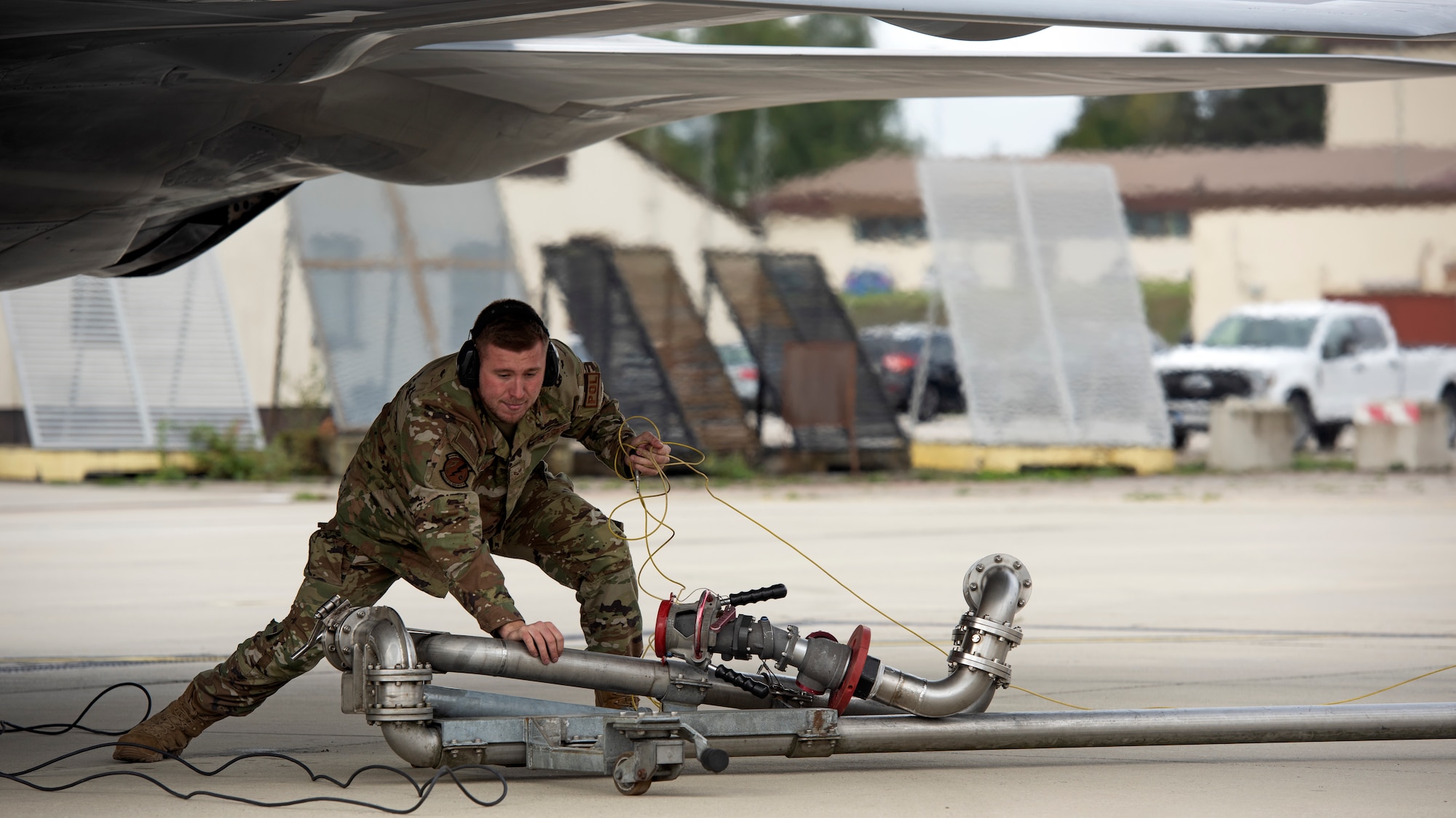 An LRS Airman refuels an F-22 Raptor.