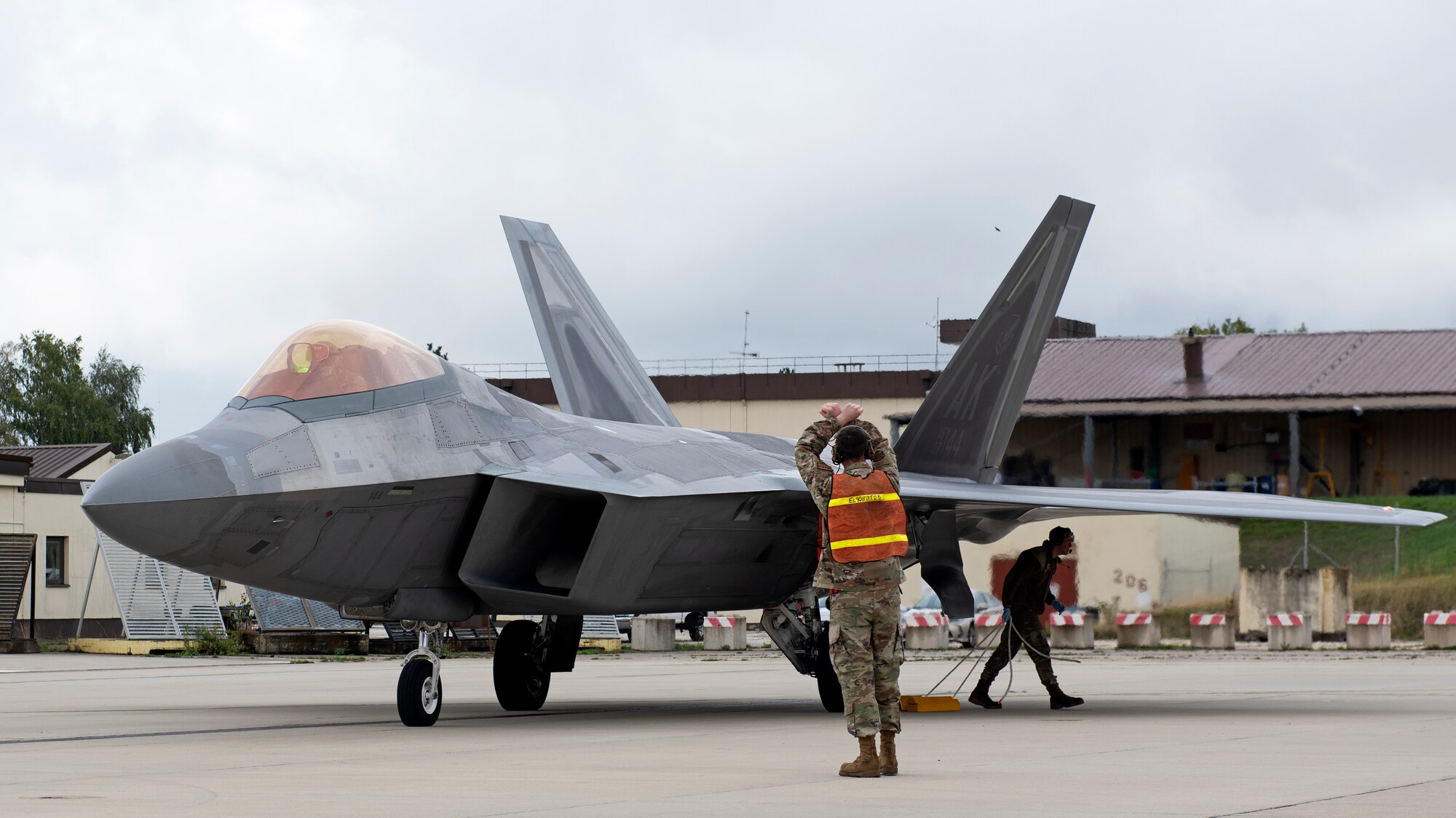 An F-22 Raptor prepares to take off after being refueled.
