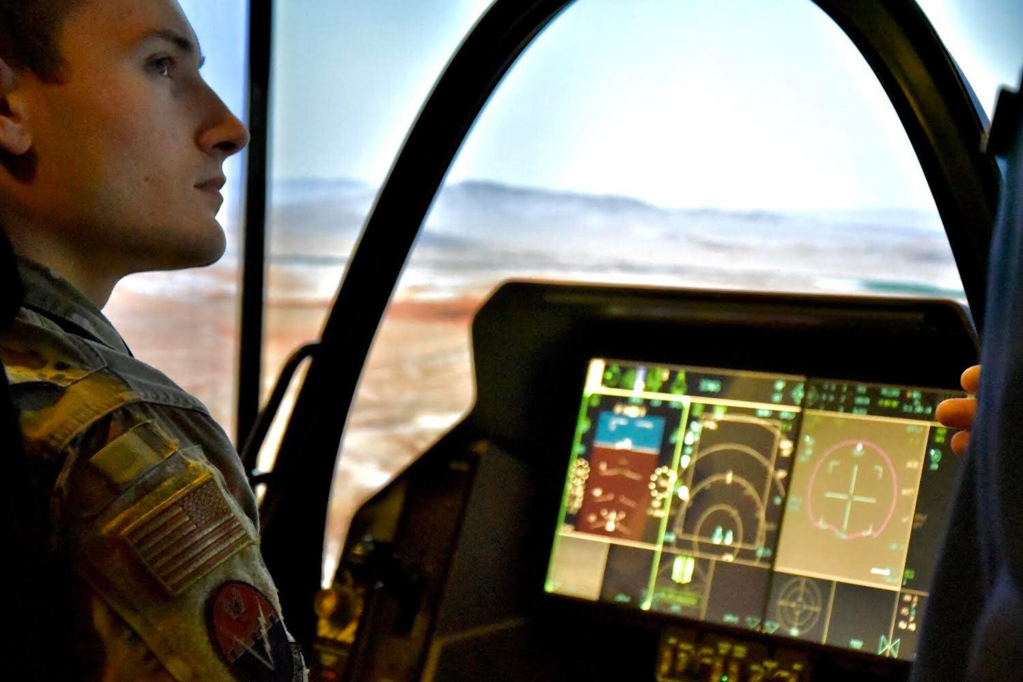 U.S. Air Force 2nd Lt Ivan Stiscia, 16th Electronic Warfare Squadron data engineer, listens to instructions on how to operate an F-35 flight simulator during the Air, Space & Cyber Conference in Washington D.C., Sept. 21, 2022. Members from the 350th SWW had the opportunity to hear key leaders speak on panels and interact with vendors in the exhibit hall to learn more about capabilities being offered to the U.S. Air Force. (U.S. Air Force photo by 1st Lt Benjamin Aronson)