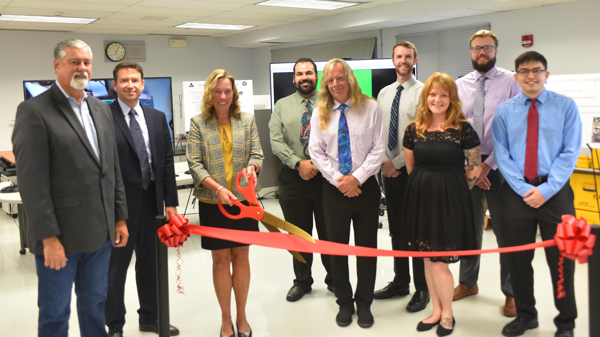 A ribbon cutting ceremony marked the official opening for the new Supply Chain Risk Management Lab at Naval Air Warfare Center Aircraft Division Lakehurst Sept. 22. Left to Right: Jack Martenak, Gregory A. Sleppy, Kathleen P. Donnelly, Dan Ackley, Jack Menzies, David Hayes, Kristina Harrington, Troy Dermond, Frank Lenge. (U.S. Navy photo)
