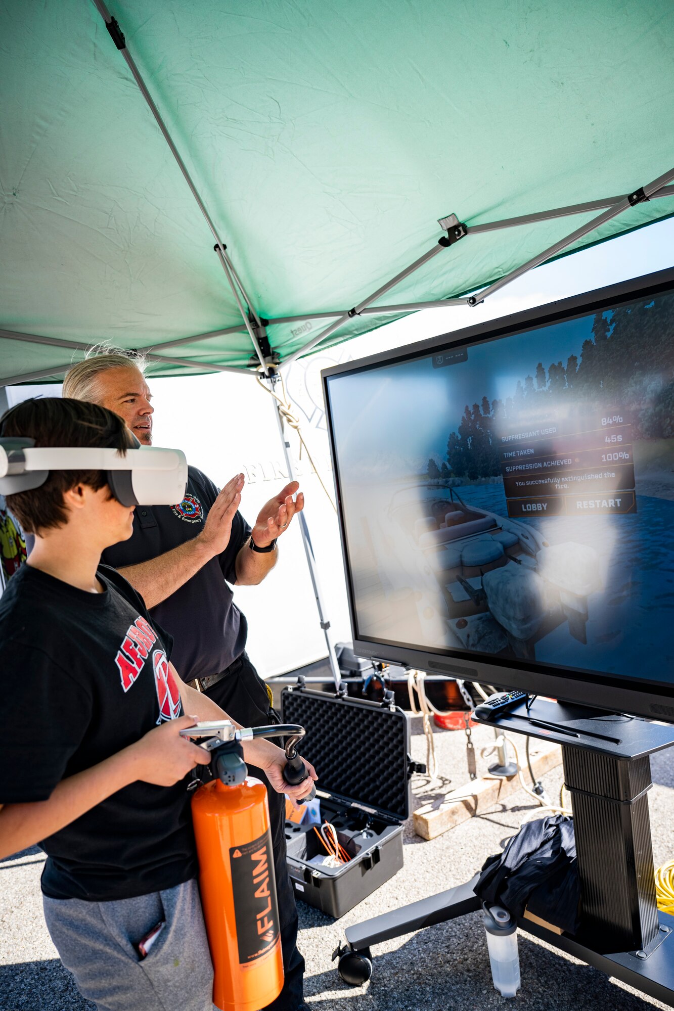 A child uses virtual reality to fight a fire.