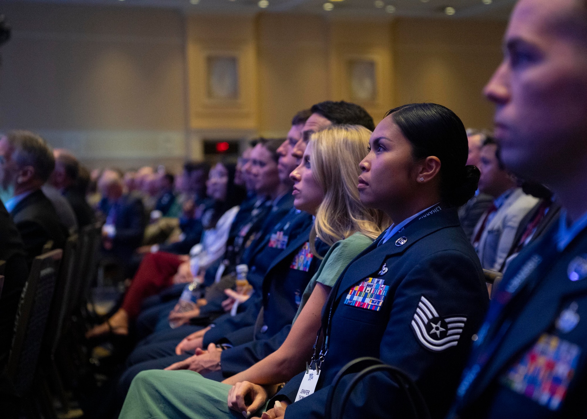 Tech. Sgt. Jennifer G. Thomas, 2022 Outstanding Airman of the Year representing Air Force Material Command, listens to Secretary of the Air Force Frank Kendall’s keynote address at the Air and Space Forces Association’s Air, Space and Cyber Conference in National Harbor, Md., Sept. 19, 2022. Thomas was recognized as one of the 12 Outstanding Airmen of the Year based upon superior leadership, job performance and personal achievement. (U.S. Air Force photo by Staff Sgt. Nick Z. Erwin)
