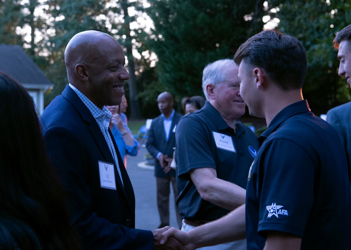 Air Force Chief of Staff Gen. CQ Brown, Jr., greets Senior Airman Caden A. Soper, 2022 Outstanding Airman of the Year representing Pacific Air Forces, during the 12 Outstanding Airmen of the Year social at Andrews Air Force Base, Md., Sept. 18, 2022. Soper was recognized as one of the 12 Outstanding Airmen of the Year based upon superior leadership, job performance and personal achievement. (U.S. Air Force photo by Staff Sgt. Nick Z. Erwin)