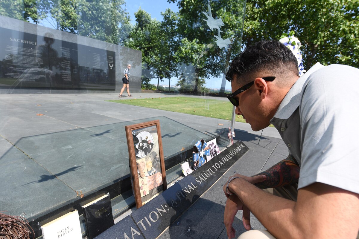 Senior Airman Demarion Davis, 2022 Outstanding Airman of the Year representing United States Air Forces Europe and Air Forces Africa, looks at a memorial centerpiece at the Air Force Memorial in Arlington, Va., Sept. 18, 2022. Davis, along with the other 12 Outstanding Airmen of the Year, attended a National Capital region tour where they visited different historical and national landmarks across Virginia, Maryland and Washington, D.C. (U.S. Air Force photo by Staff Sgt. Nick Z. Erwin)