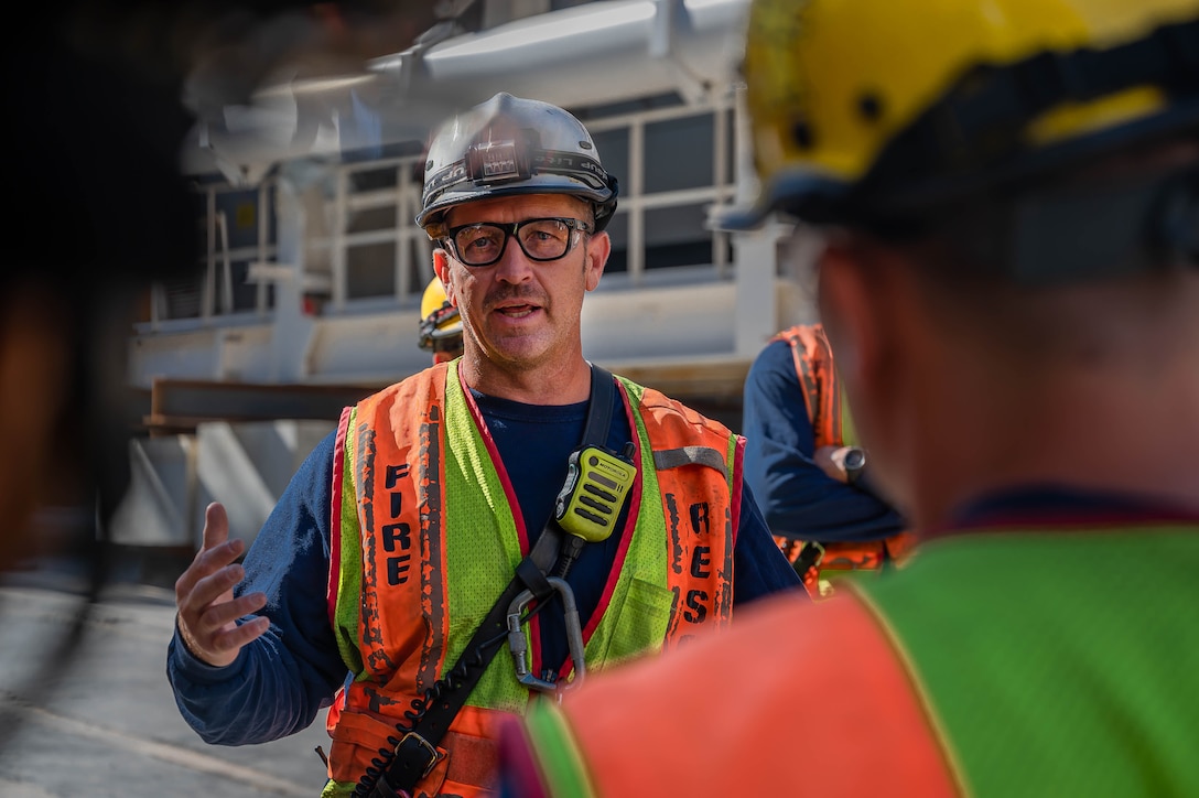 The on-site incident commander, Captain Jeremy Williams, Norfolk Fire Rescue coordinator, explains factors to consider for a rescue mission during the construction of the Hampton Roads Bridge-Tunnel at the South Island excavation site, Hampton, Virginia, Sept. 25, 2022.