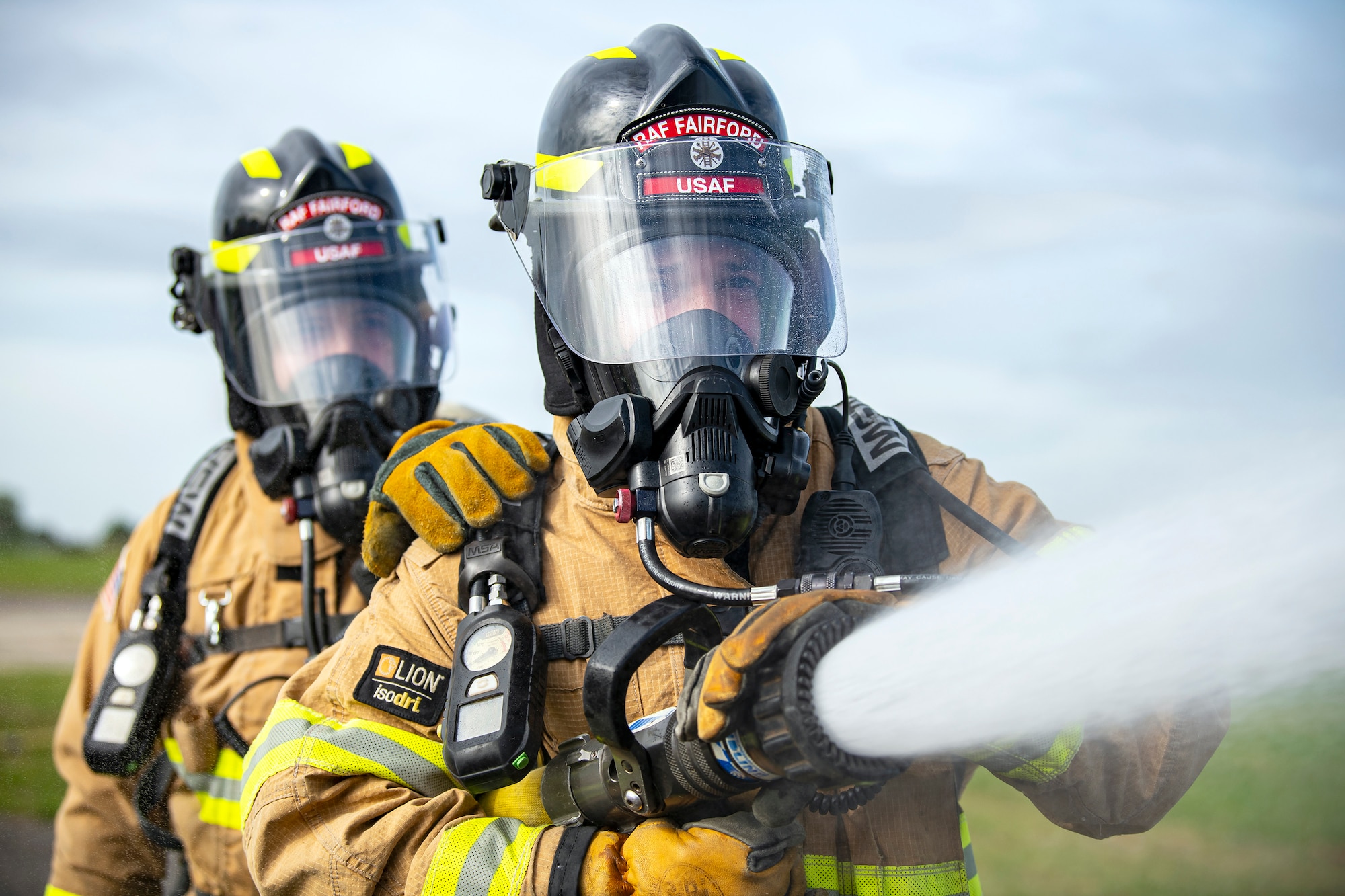 Firefighters from the 422d Fire Emergency Services extinguish an aircraft fire during a live-fire training exercise at RAF Fairford, England, Oct. 3, 2022. Firefighters from the 422d FES are required to complete live-fire training bi-annually to test their overall readiness and ability to properly extinguish an aircraft fire. (U.S. Air Force photo by Staff Sgt. Eugene Oliver)