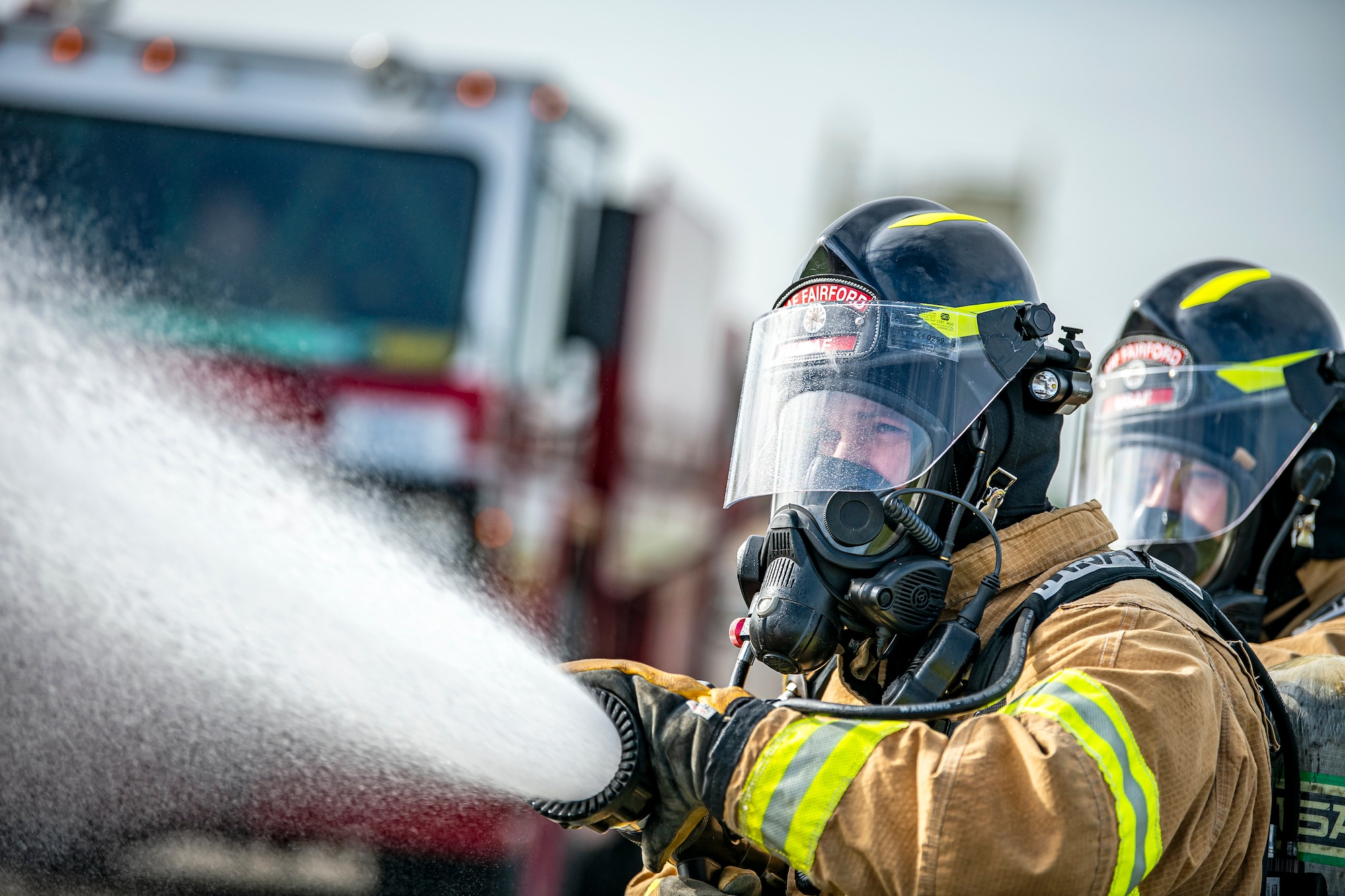 Firefighters from the 422d Fire Emergency Services extinguish an aircraft fire during a live-fire training exercise at RAF Fairford, England, Oct. 3, 2022. Firefighters from the 422d FES are required to complete live-fire training bi-annually to test their overall readiness and ability to properly extinguish an aircraft fire. (U.S. Air Force photo by Staff Sgt. Eugene Oliver)