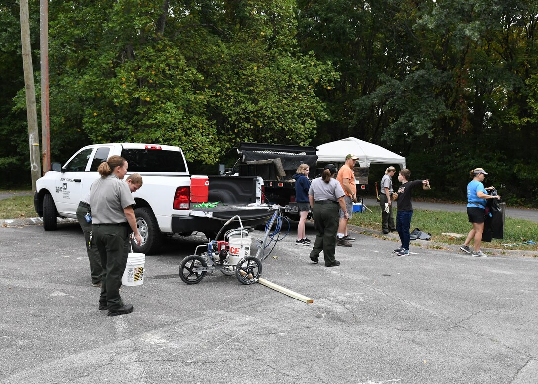 Volunteers arrived at the Stark Knob Boat Ramp on Old Hickory Lake around 9 a.m., ready to work. Rangers set up a tent with cleaning supplies, spray paints, bags, gloves, and other cleaning supplies.