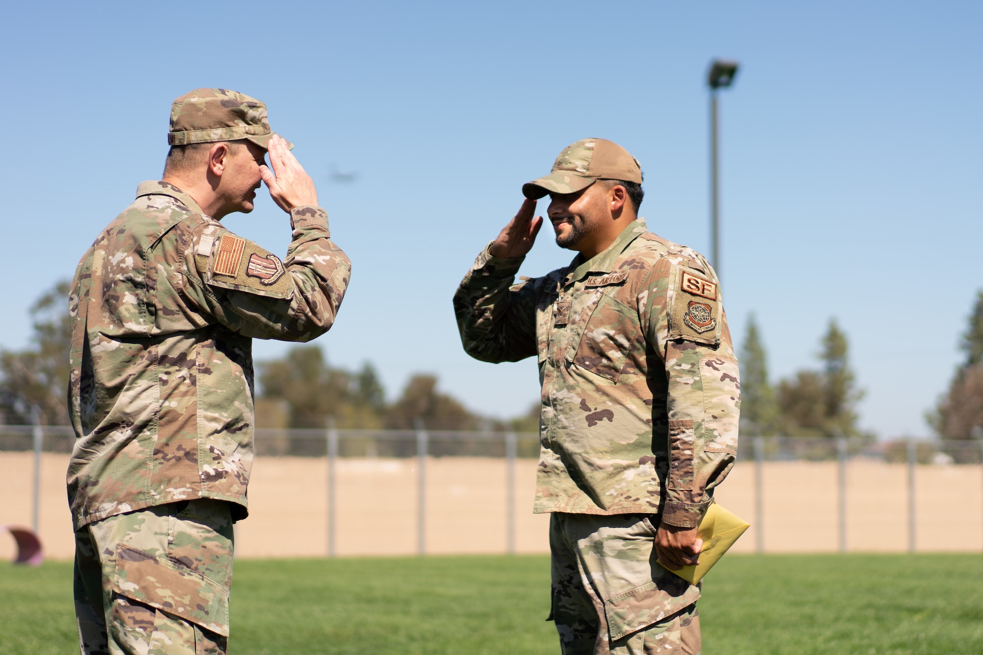 Airman salutes officer