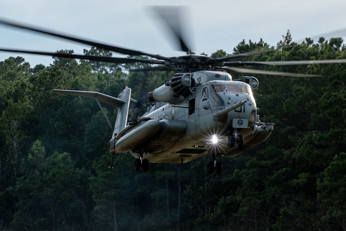 A U.S. Marine Corps CH-53E Super Stallion helicopter assigned to the 2nd Marine Aircraft Wing transports U.S. Marines with 1st Battalion, 6th Marine Regiment, 2d Marine Division, to an insertion location during a Marine Corps Combat Readiness Evaluation on Camp Lejeune, North Carolina, Sept. 27, 2022. The purpose of a MCCRE is to formally evaluate the unit’s combat readiness in preparation for deployment. (U.S. Marine Corps photo by Cpl. Nayelly Nieves-Nieves)