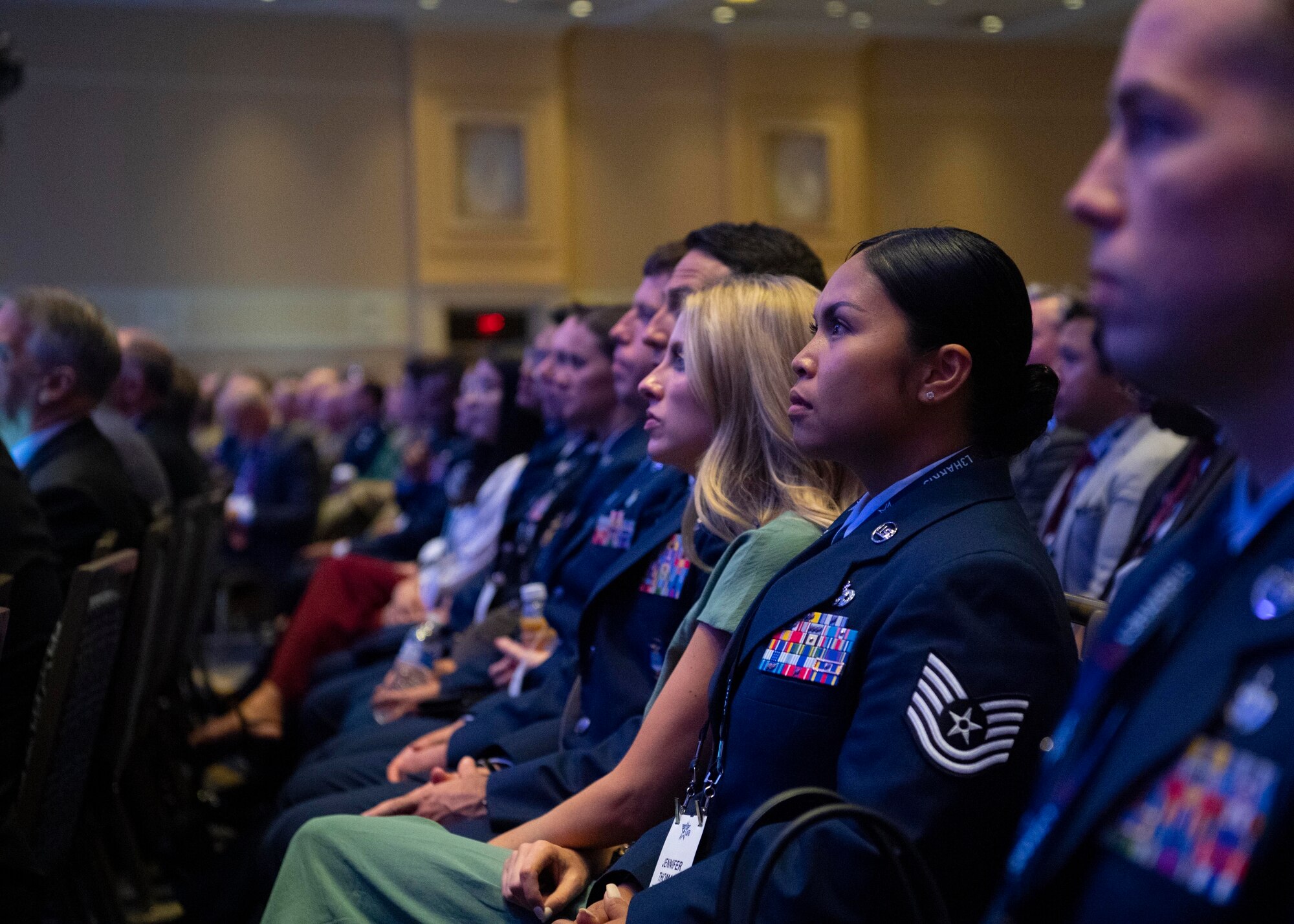 Tech. Sgt. Jennifer G. Thomas, 2022 Outstanding Airman of the Year representing Air Force Material Command, listens to Secretary of the Air Force Frank Kendall’s keynote address at the Air and Space Forces Association’s Air, Space and Cyber Conference in National Harbor, Md., Sept. 19, 2022. Thomas was recognized as one of the 12 Outstanding Airmen of the Year based upon superior leadership, job performance and personal achievement. (U.S. Air Force photo by Staff Sgt. Nick Z. Erwin)