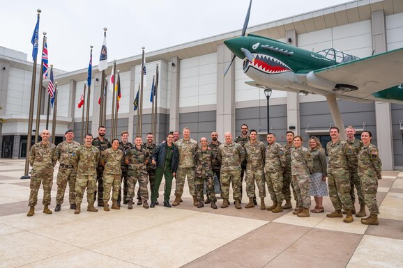Members of the Space Tacticians course stand together for a group photo in front of the Combined Force Space Component Command at Vandenberg Space Force Base, Calif., Sept. 29, 2022. The course, which aimed at enhancing global space operations by training in effective tactical planning, consisted of Airmen, Guardians, Coalition partners and for the first time, eight French Space operators from the French Space Command. (U.S. Space Force photo by Tech. Sgt. Luke Kitterman)