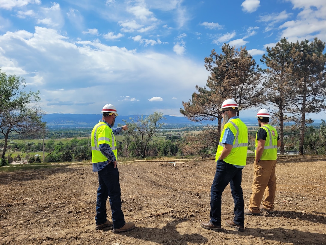 Richard (Rick) Weixelbaum, (center), Mission Manger, from the USACE Kansas City District, surveys a final parcel close out during a site visit in Boulder County, Colorado. (courtesy photo)