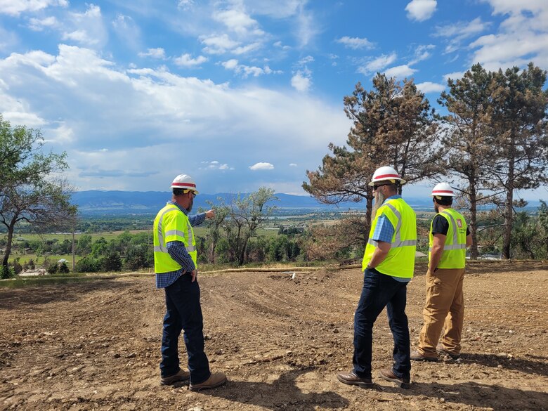 Richard (Rick) Weixelbaum, (center), Mission Manger, from the USACE Kansas City District, surveys a final parcel close out during a site visit in Boulder County, Colorado. (courtesy photo)