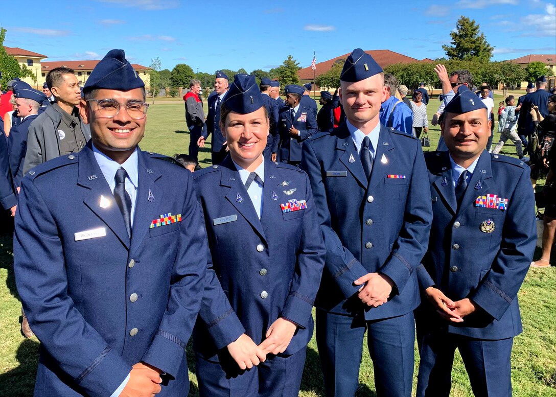 1st Lieutenant Jessica Thompson poses with classmates from her Officer Training School, during her graduation ceremony Sept. 30, 2022.