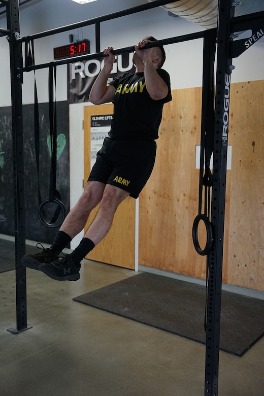 2nd Lt. James Royals, an infantry officer with 1st Battalion, 297th Infantry Regt., finishes the pull-up portion of the baseline physical fitness test given during the annual wellness camp held at Camp Carroll, Joint Base Elmendorf-Richardson, Alaska Aug. 29, 2022. The annual wellness camp focuses on the Army’s Holistic Health and Fitness concept and prepares Soldiers to maintain an overall healthy lifestyle. (Alaska National Guard photo by Staff Sgt. Katie Mazos-Vega)