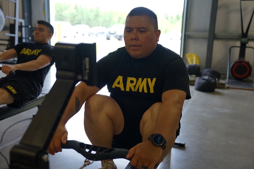 Sgt. Terry Proud, an infantryman with Alpha Company, 1st Battalion, 297th Infantry Regt., rows as part of the baseline physical fitness test for the wellness camp held at Camp Carroll, Joint Base Elmendorf-Richardson, Alaska, Aug. 29, 2022. The annual wellness camp focuses on the Army’s Holistic Health and Fitness concept and prepares Soldiers to maintain an overall healthy lifestyle. (Alaska National Guard photo by Staff Sgt. Katie Mazos-Vega)