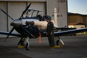 U.S. Air Force Col. Alexander Heyman, 14th Flying Training Wing Operations Group commander, looks over his T-6A Texan II tail number 014 in the maintenance quadrant, September 30, 2022, on Columbus Air Force Base, Miss. The T-6 is a single-engine, two-seat primary trainer designed to train pilot training students in basic flying skills common to U.S. Air Force and Navy pilots.