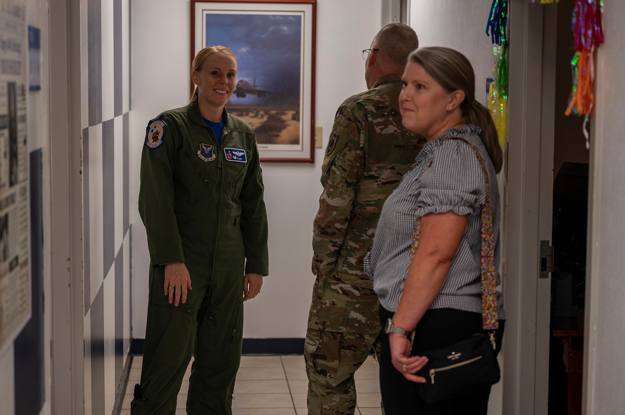 Lt. Col. Kristen Jenkins, 28th Bomb Squadron commander, gives Lt. Gen. Mark Weatherington, Air Force Global Strike Command deputy commander, and his spouse, Stephanie Weatherington, a tour of the 28th BS at Dyess Air Force Base, Texas, Sept. 23, 2022. Weatherington had once commanded the 28th BS before relinquishing command in 2008. While visiting the squadron, he was given a brief on their updated training. (U.S. Air Force photo by Senior Airman Reilly McGuire)