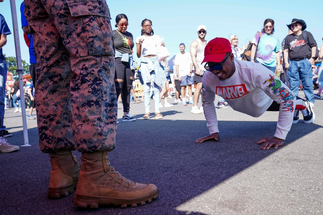 U.S. Marines with Recruiting Substation Springfield interact with the attendees of the annual New York State Fair in West Springfield, Massachusetts, Sept. 17, 2022. The yearly festival welcomes people from all over the state to experience the numerous animal exhibits, commercial attractions, festival rides, food and entertainment. (U.S. Marine Corps photo by Sgt. Tojyea G. Matally)