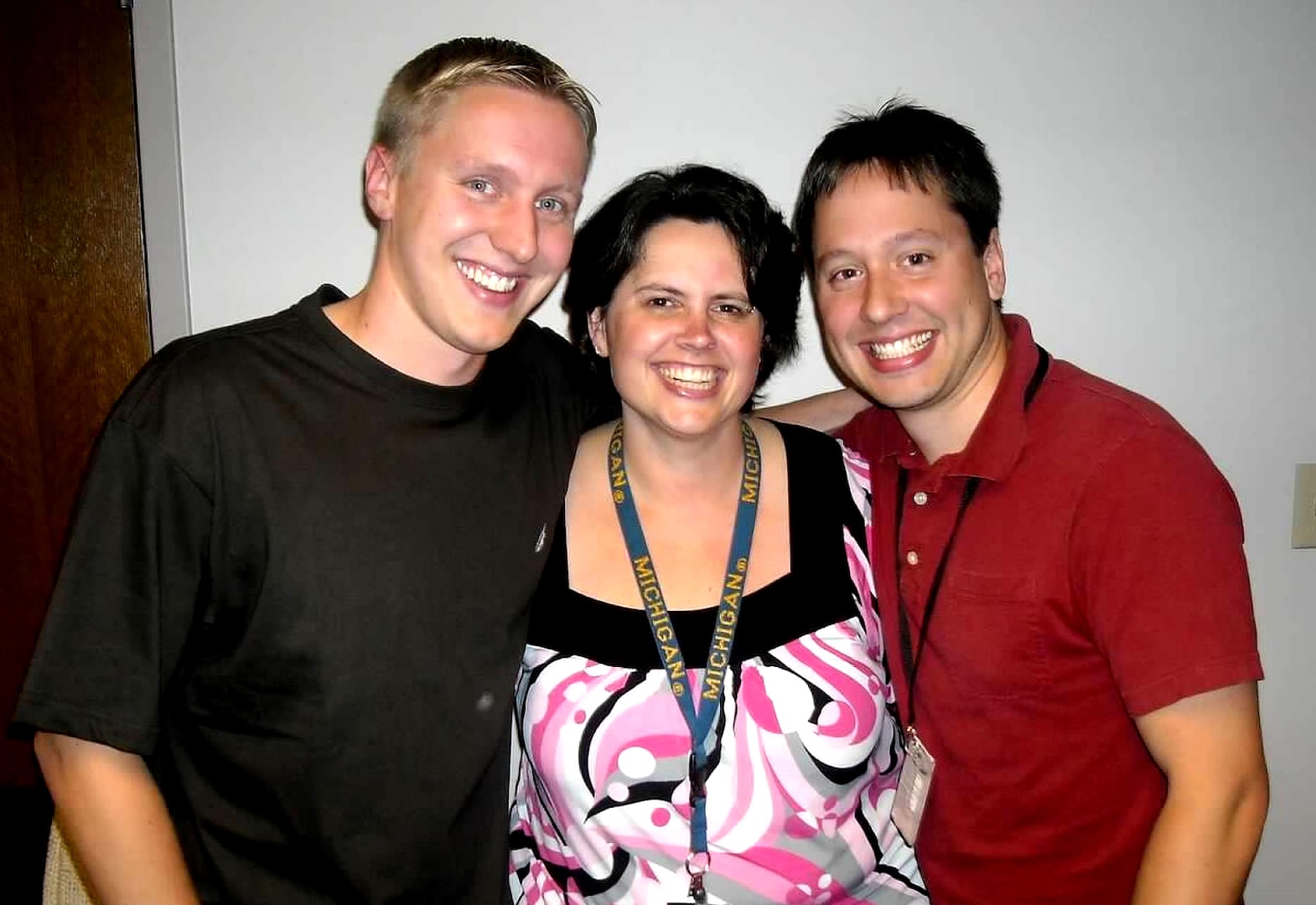 Group photo of two men and one woman.