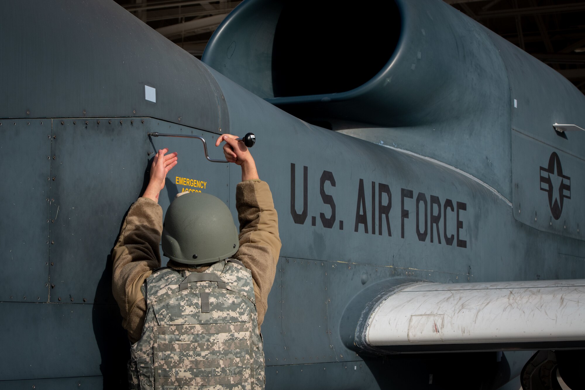 An airman assigned to the 319th Aircraft Maintenance Squadron removes a panel from an RQ-4 Global Hawk Block 40 aircraft Sept. 27, 2022, during Readiness Exercise Validation Global Griffin 09-22 at Grand Forks Air Force Base, North Dakota. Airmen assigned to the 319th RW continued to support real-world operations during the exercise. (U.S. Air Force Photo by Senior Airman Phyllis Jimenez)