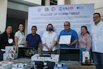 USAID Office of Health Director Michelle Lang-Alli and Humanitarian Assistance Officer Rachel Gallagher join Surigao Del Norte Governor Robert Lyndon Barbers at the turnover ceremony of COVID-19 response supplies and equipment on September 27.