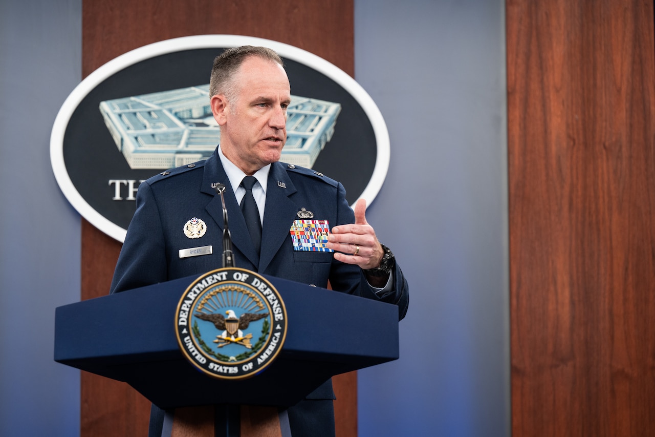 A man speaks from a podium.