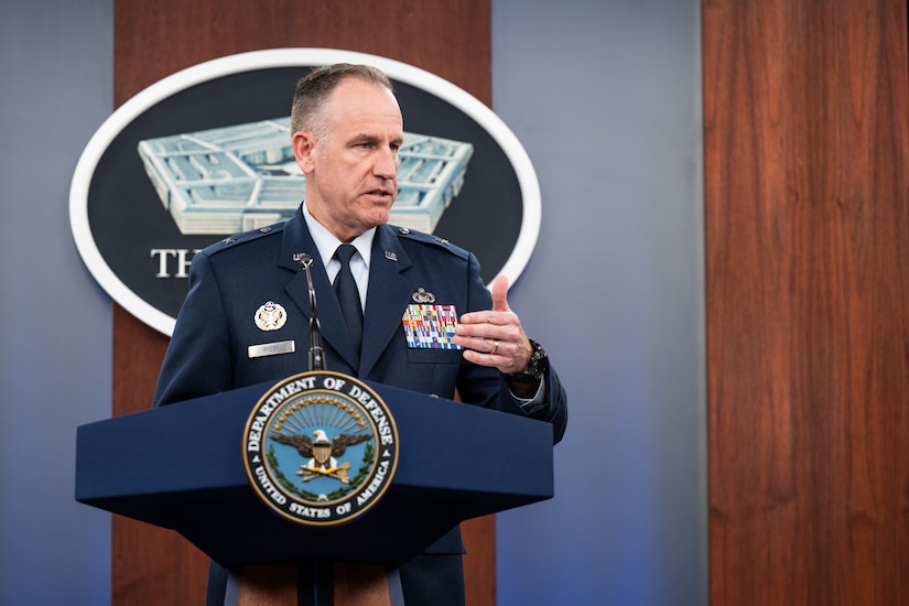 A man speaks from a podium.