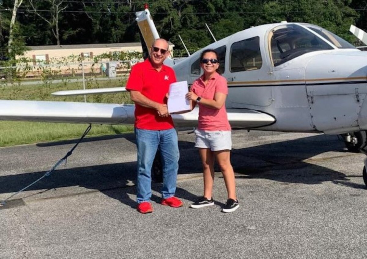 Air Force Junior ROTC Cadet Lexy Ly, Cherokee High School AFJROTC Unit GA-953, Canton, Georgia, is presented with her private pilot certificate from Lamar Childs, her designated pilot examiner at the University of West Florida in Pensacola. Ly graduated from the AFJROTC Flight Academy on July 22, 2022, and she said her dream has always been of being a pilot, fighting for her country and being a hero.