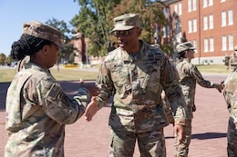 Maj. Gen. Michel M. Russell Sr. shakes a Soldier's hand.