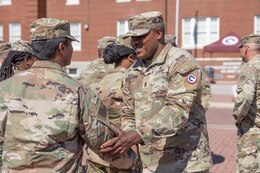 Command Sgt. Maj. Albert E. Richardson Jr. shakes hand